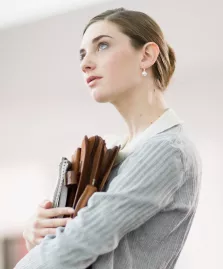young woman holding files